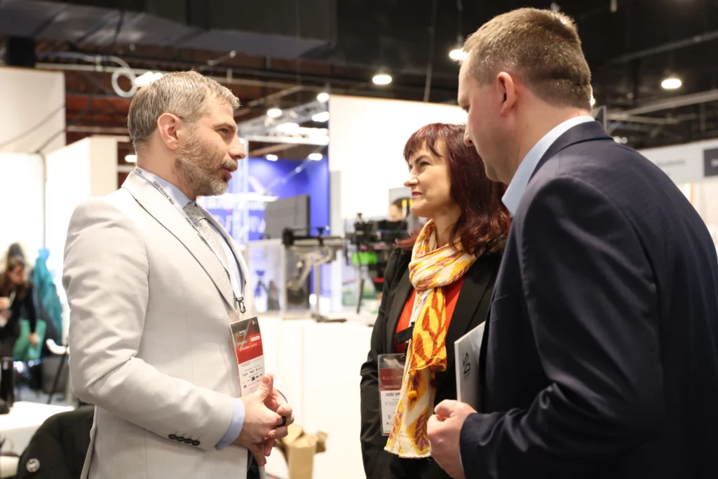 Two men and a woman having a conversation.