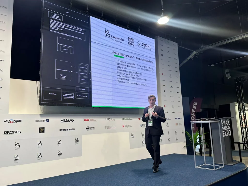 Man giving a presentation while walking across the stage.